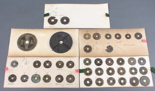 A quantity of Chinese bronze coins including Chin and Northern Chow attached to 5 cards 