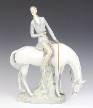 A Lladro figure of a gentleman on horseback 43cm 