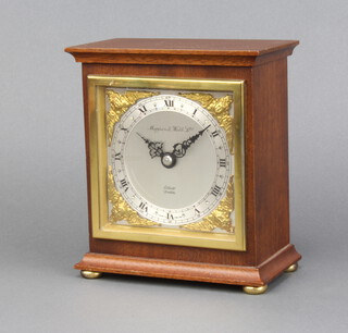 Elliott for Mappin & Webb, a mantel timepiece with silvered dial, gilt spandrels and Roman numerals, contained in a walnut case  