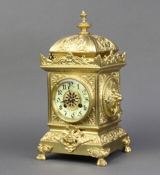 S Marti, a 19th Century French striking mantel clock with enamelled dial and Arabic numerals contained in a gilt metal case surmounted by a lidded urn complete with pendulum and key