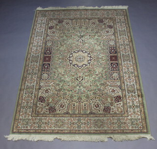 A green and white ground Belgian cotton Persian style rug with central medallion 227cm x 160cm 