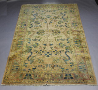A pink and floral patterned Persian carpet with a 3 row border 303cm x 203cm 