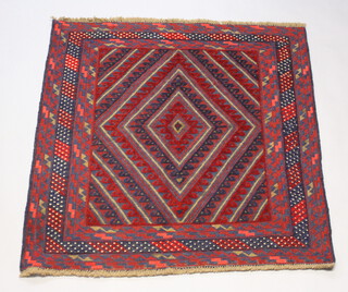 A red and blue ground Gazak rug with diamond medallion to the centre within a 4 row border 118cm x 113cm 