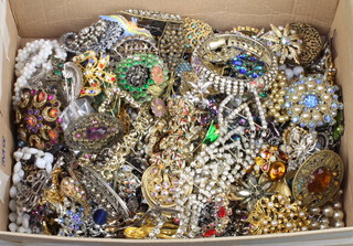 A quantity of costume jewellery including brooches and necklaces