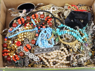 A quantity of costume jewellery including brooches, necklaces etc 