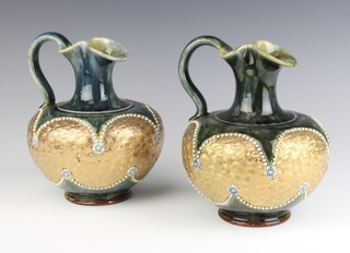 A pair of Royal Doulton green and gilt glazed squat jugs, bases impressed Royal Doulton and incised RM8292 7cm