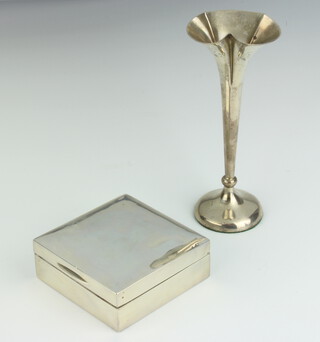 A plain silver cigarette box with hinged lid, Birmingham 1934, 3cm h x 8.5cm w x 9cm d together with an Edwardian silver specimen vase Birmingham 1906 16cm h
