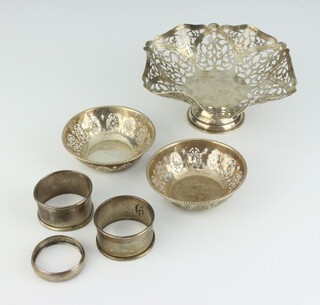 A circular pierced silver bowl London 1966, pair of circular pierced silver bowls Birmingham 1918 (f), 3 silver napkin rings, 162 grams 