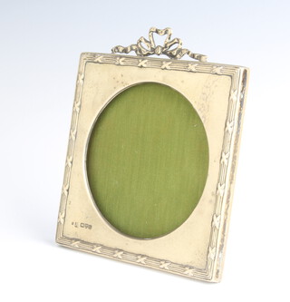 An Edwardian square embossed silver easel photograph frame with garland decoration Chester 1905 14cm x 12cm 
