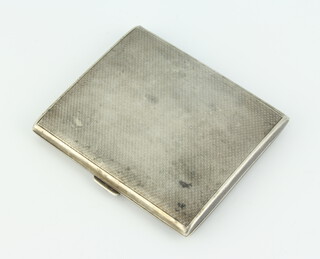 A silver cigarette case with engine turned decoration London 1933, 19 grams