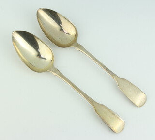 A pair of George III silver fiddle pattern table spoons, London 1785, 123 grams 