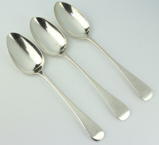 A George III silver Old English pattern table spoon, London 1810, together with a pair of Victorian silver Old English pattern table spoons London 1891, 220 grams 
