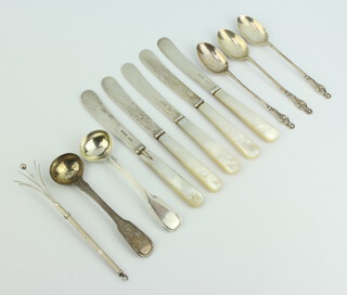 A pair of George III silver fiddle and thread pattern mustard spoons London 1817, 3 silver apostle teaspoons, a sterling silver swizzle stick with engine turned decoration, 5 silver bladed and mother of pearl handled butter knives, weighable silver 81 grams 