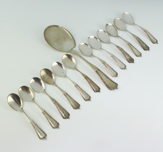 A 13 piece Continental silver fruit service comprising serving spoon and 12 spoons, 242 grams 