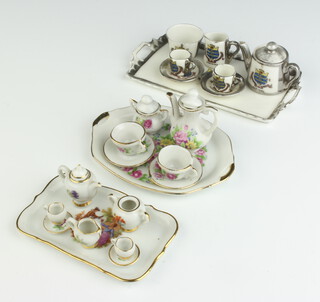 A miniature Continental porcelain crested china 6 piece miniature coffee service decorated The Arms of Worthing together with 2 other miniature coffee services and tray 