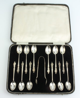 A set of 12 silver apostle spoons and tongs Birmingham 1940, 166 grams, cased 