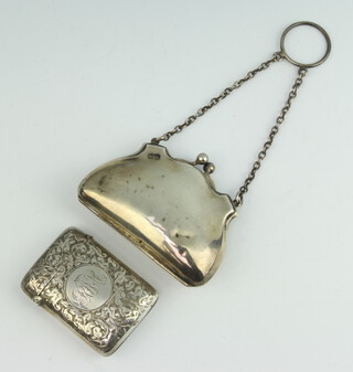 A Victorian engraved silver vesta case Birmingham 1891 together with a silver purse Birmingham 1919, some dents to the purse 