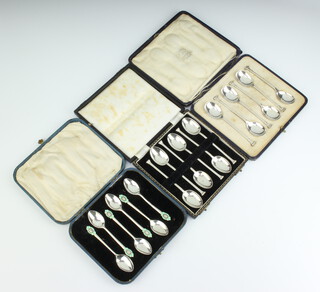 A set of Edwardian silver nail end coffee spoons Birmingham 1906 by Mappin & Webb ditto set of 6 coffee spoons Sheffield 1916 and a set of 6 silver and enamelled coffee spoons Birmingham 1961 (1f), all cased, 166 grams