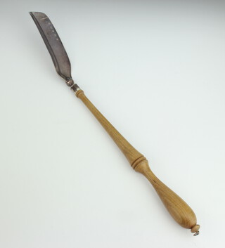 A silver shoe horn with turned wood handle 53cm