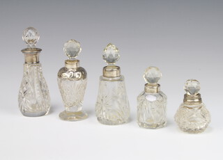 An Edwardian silver mounted toilet bottle, London 1904, 7cm and 4 others 