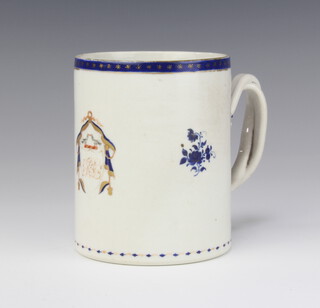 An 18th Century Chinese blue and white mug with armorial and entwined handle 11cm 