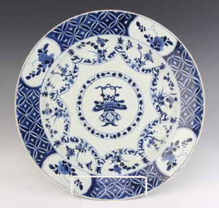 An 18th Century Chinese plate, the centre decorated with a vase of flowers enclosed by a border of flowers 35cm 