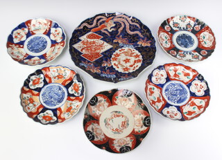 A Japanese Imari plate with panel decoration and scallop border, the base with seal mark 31cm and 5 other Japanese Imari plates 20cm 