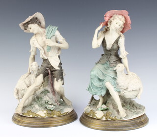 A pair of Capodimonte figures of Shepherd and Shepherdess raised on turned wooden bases 25cm 