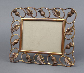 An Art Nouveau pierced gilt metal easel photograph frame decorated thistles, the reverse marked D.R.G.M 18cm x 22cm 