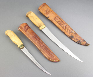 A Normark filleting knife with 22cm blade contained in a leather scabbard marked J.M Marttiini Finland, together with a Rapala filleting knife with 15cm blade and leather scabbard 