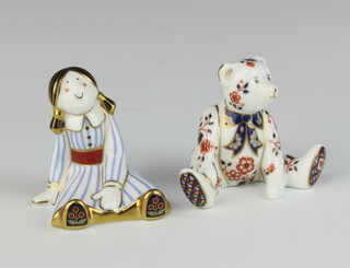A Royal Crown Derby Childhood Rag Doll paperweight marked MMV (no stopper) together with a 1998 Royal Crown Derby paperweight in the form of a seated bear marked B (no stopper) 
