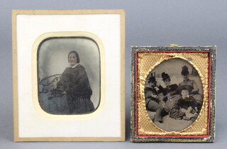 Early black and white photograph of a seated family group 7cm x 6cm contained in a gilt and leather frame together with 1 other portrait of a standing lady, the reverse marked from A E Mount photographer artist of Blyburgate Street, Beccles 7cm x 6cm  