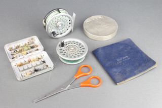 A Hardy Brothers Marquess 5 weight fishing reel with spare spool and linens, a Farlows cast wallet and a Wheatley fly box 