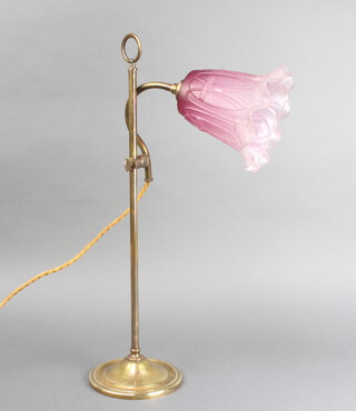 An Edwardian brass adjustable table lamp with pink glass shade 50cm 