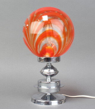 A 1960's glass and chrome table lamp with orange and clear glass striped shade, raised on a chrome circular base 32cm h x 17cm diam.  