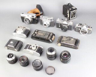 A Retinette 1A camera, a Pentax ME camera, a Halina 6-4 camera, Zenith-E, a Finetta camera, Canon Canonet camera, Zeiss Iron folding camera, a Soho Pilot folding camera, a Brownie folding camera, Brownie Model E box camera, together with 4 lenses - BBAR Multi C 1 7:8 F=28mm, Auto Chinon zoom MC Macro 35-70mm, Yashica DBS 55mm 1:2 lens, Olympus AF zoom 35-70mm lens and an Olympus 50mm 1:2PF lens 