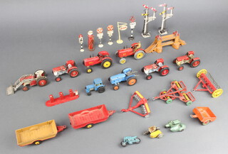 Two Dinky red Massey Ferguson tractor (1 missing figure of the farmer) together with other model tractors, farm machinery etc 
