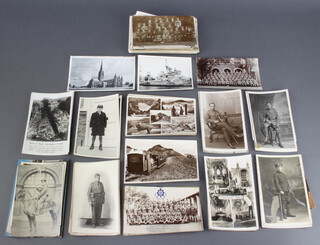 A collection of black and white postcards and photographs, some military 
