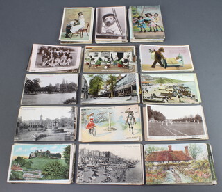 A collection of black and white and coloured postcards