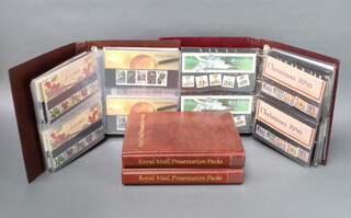 Four albums of Elizabeth II GB mint presentation stamps 