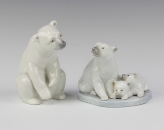 A Lladro figure group of a seated polar bear and cubs, base impressed A-9N 9cm (crack to base) and 1 other base marked A8M 12cm