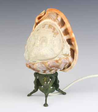 A table lamp formed from a carved conch shell raised on a gilt metal base 21cm h x 12cm x 9cm 