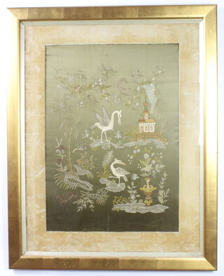 A Victorian stitch work panel depicting fabulous birds by a pagoda 72cm x 20cm contained in a gilt frame 