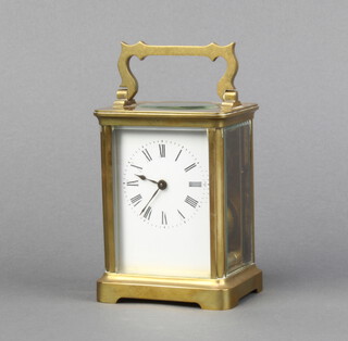 A 19th Century French carriage timepiece with enamelled dial contained in a gilt case 