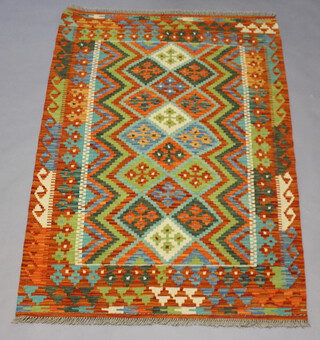 A green, turquoise and blue ground Chobi Kilim rug, the central field with all over geometric designs 158cm x 106cm  