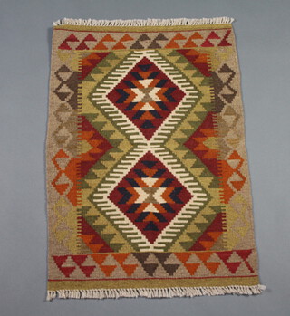 A brown and green ground Maimama Kilim with 2 diamonds to the centre 92cm x 64cm 