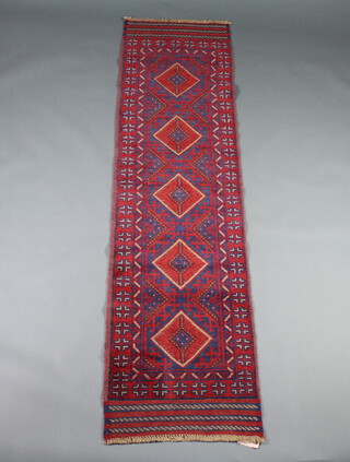 A red and blue ground Meshwani runner with 5 diamonds to the centre within a multi row border 236cm x 63cm 