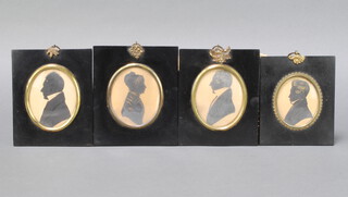 A 19th Century oval silhouette of a lady 8cm x 7cm contained in an ebonised and gilt mounted frame, together with 3 oval portrait silhouettes of a gentleman 8cm x 7cm contained in ebonised frames 
