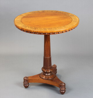 A William IV circular inlaid mahogany occasional table raised on a turned column and triform base 71cm h x 61cm diam. 