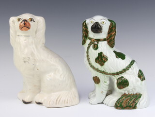 A 19th Century Staffordshire figure of a seated spaniel with separately moulded front leg 23cm and 1 other Staffordshire spaniel 25cm 